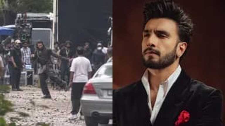 फिल्म प्रलय के शूटिंग सेट पर रणवीर सिंह का पहला लुक जिसमें वह लंबे बालों और दाढ़ी में एक बच्ची को पीठ पर उठाए नजर आ रहे हैं